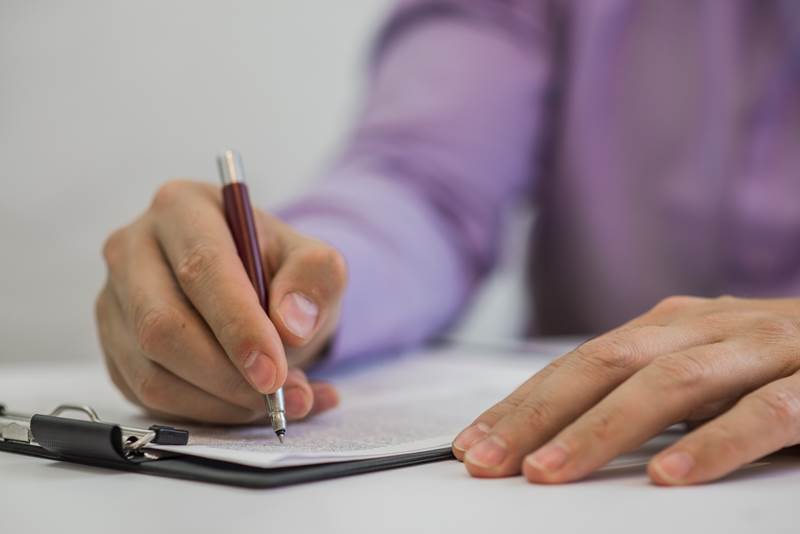 businessman-making-notes-paper-his-office.jpg